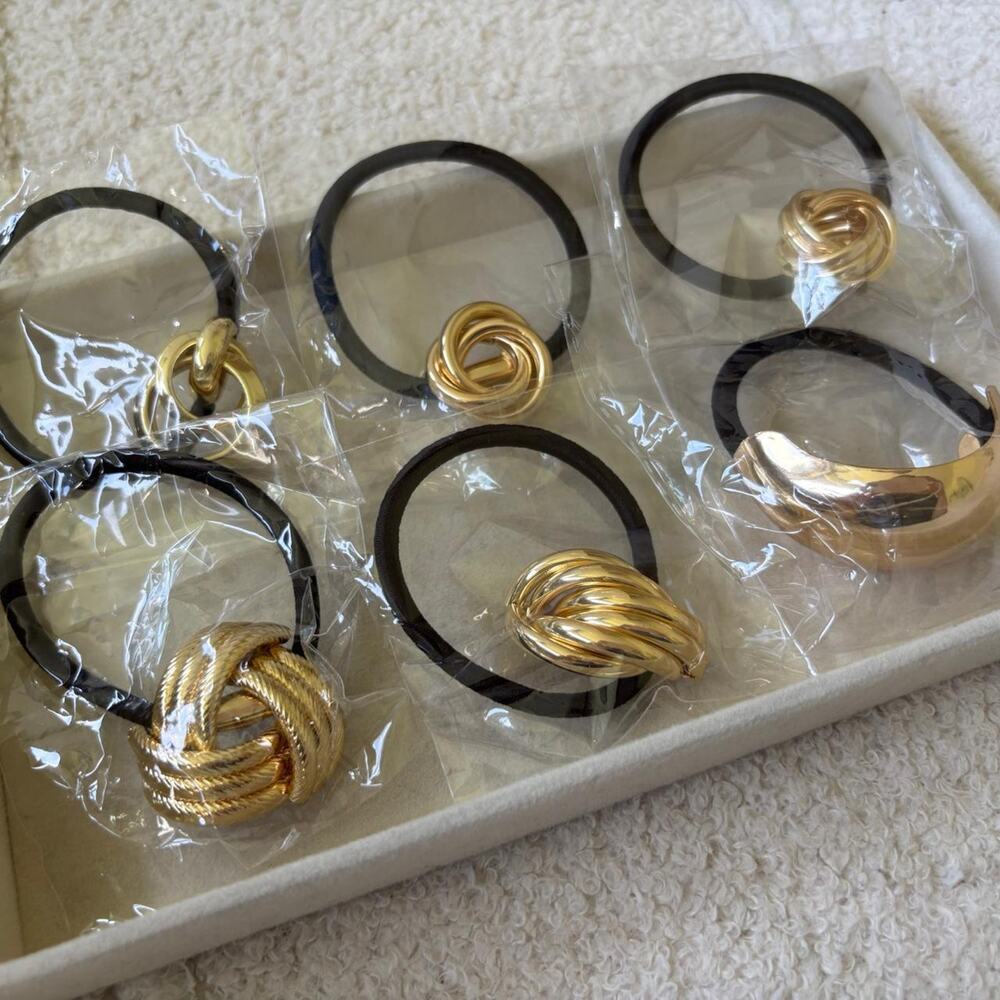 Gold and black hair ties